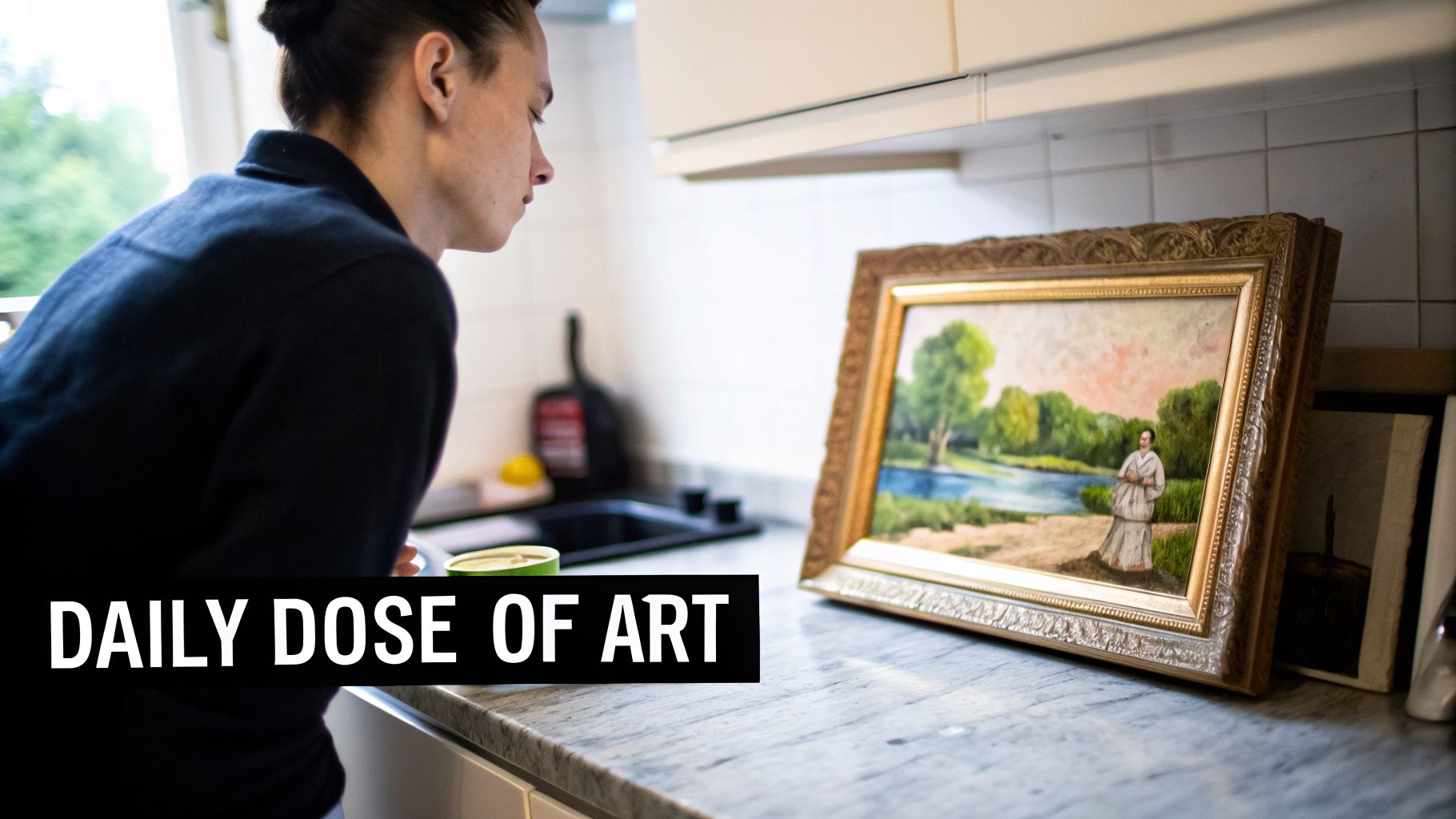 A person looking at a framed painting of a landscape with a standing figure on a kitchen countertop.